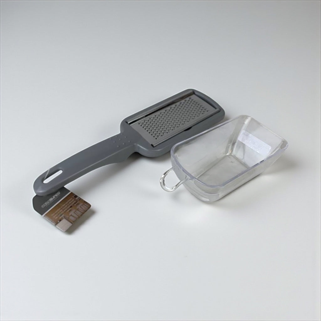 Kuhn Rikon grill brush and scrubber with a clear container on a white background