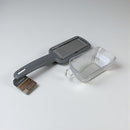 Kuhn Rikon grill brush and scrubber with a clear container on a white background