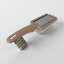 Brown kitchen grater on a white background