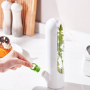 Demonstration of adding water to the fresh herb keeper for long-lasting herb storage in a stylish kitchen | Cupindy Egypt