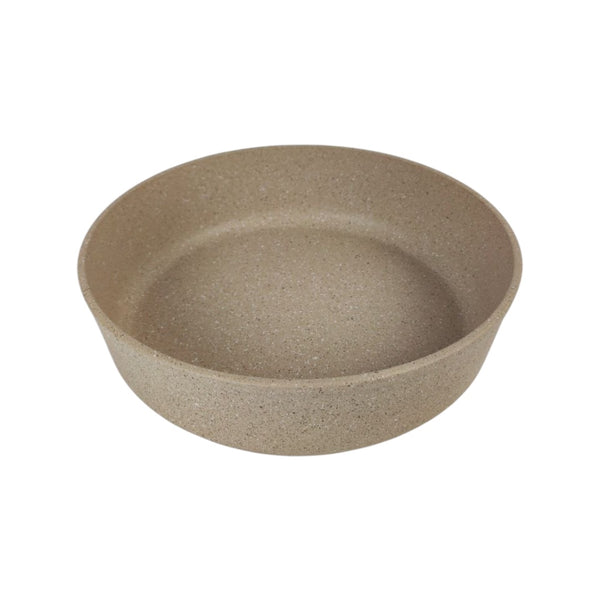 Beige ceramic bowl on a white background