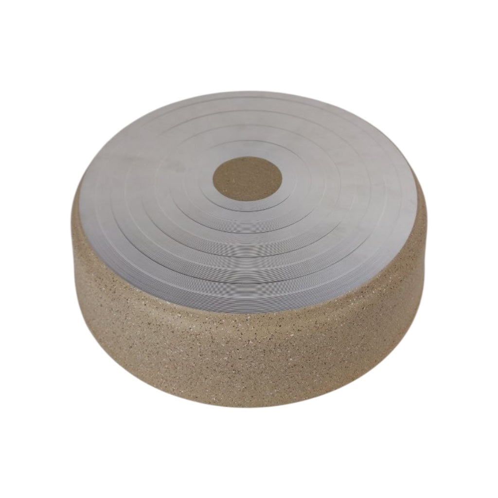 Round cork footstool with a textured gray top on a white background
