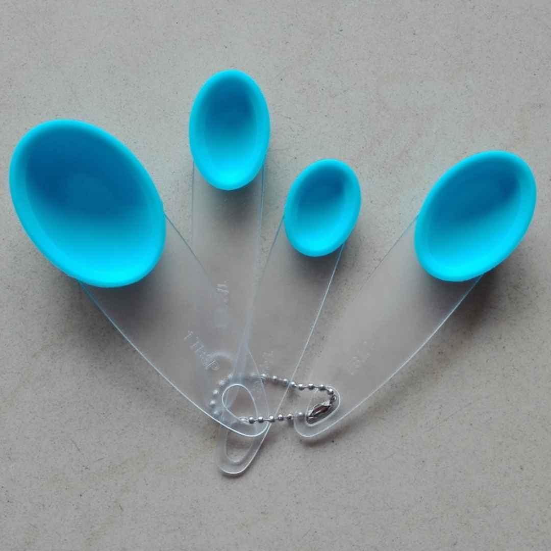 Plastic measuring spoon set in multiple sizes, essential for precise baking | Cupindy