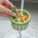 Cactus handle kitchen sink strainer basket for catching food waste and vegetable scraps.
