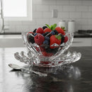 Clear glass bowl filled with berries on a kitchen counter