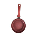 Red frying pan with speckled pattern on a white background