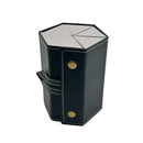 Black hexagonal leather case with gold studs on a white background