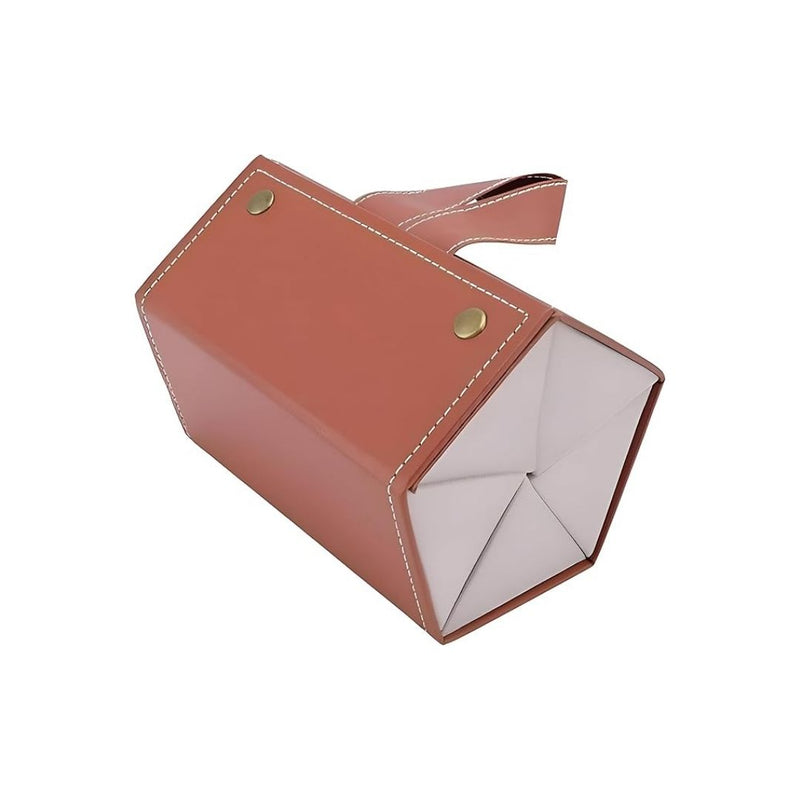 Brown leather pouch with gold studs on a white background