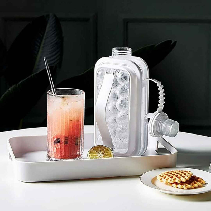 White ice cream maker on a tray with a glass of pink drink and waffles.