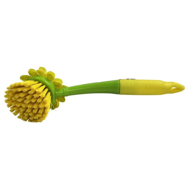 Green and yellow cleaning brush on a white background