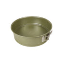 Green metal springform pan on a white background