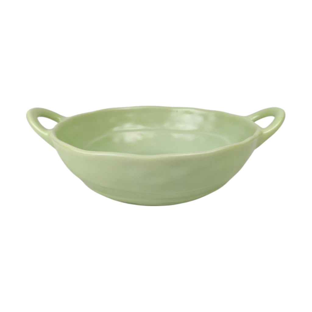Green ceramic bowl with handles on a white background