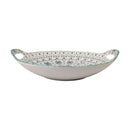 Decorative ceramic bowl with handles on a white background