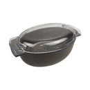 Black ceramic baking dish with a clear lid on a white background