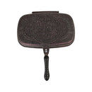 Black speckled grill pan on a white background