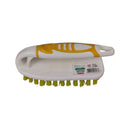 White and yellow brush with green bristles on a white background