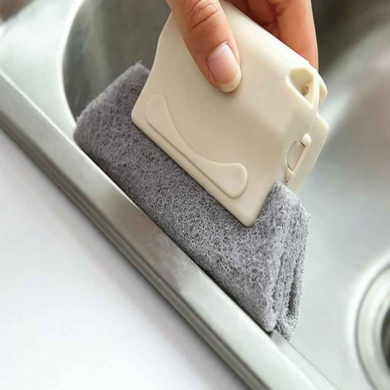 Mini handheld brush removing dirt from sliding door track