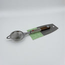 Metal strainer with wooden handle on a gray background