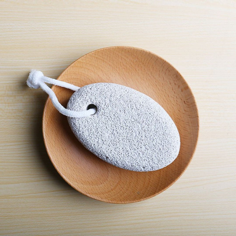 Foot scrub stone on wooden tray for home spa setup | Cupindy