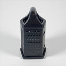 Black vegetable grater on a white background