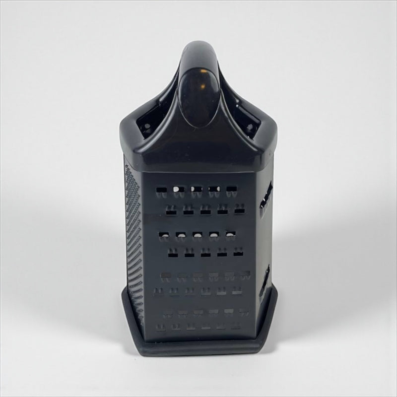 Black vegetable grater on a white background
