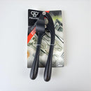Black kitchen garlic press on a white background with packaging.