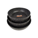 Set of three black speckled bowls stacked on a white background