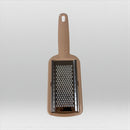 Brown handheld grater on a light gray background