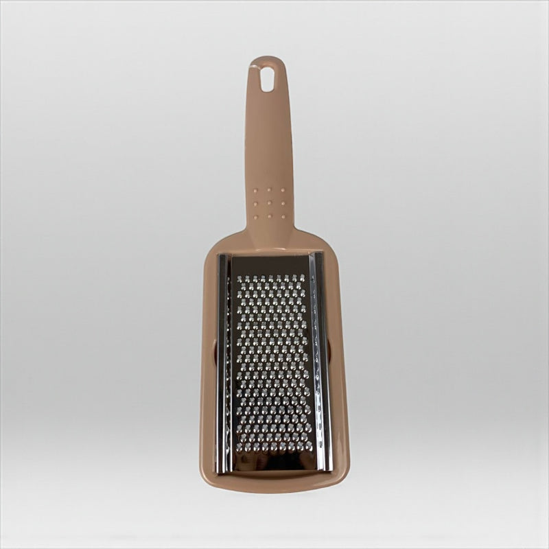 Brown handheld grater on a light gray background