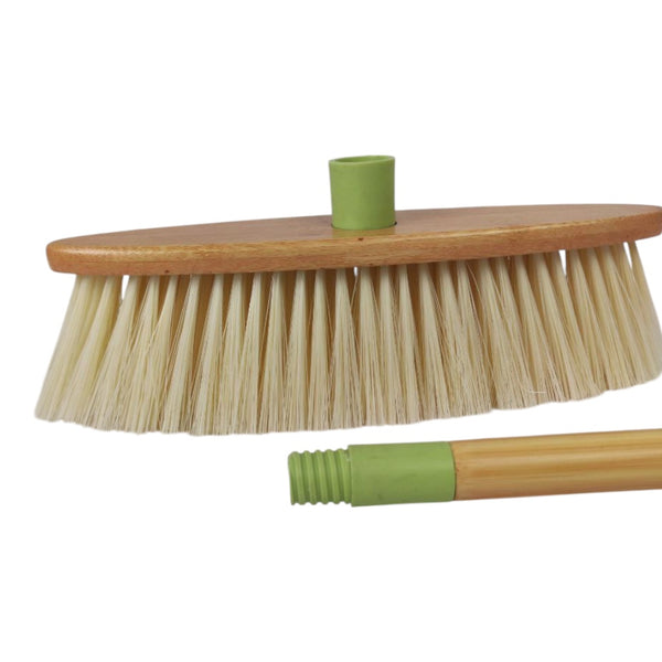 Broom with wooden handle and bristles on a white background