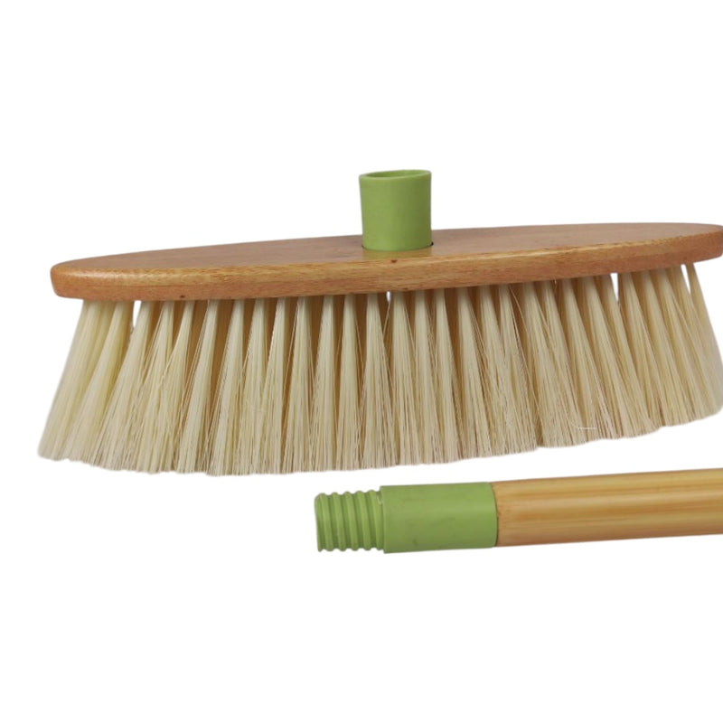 Broom with wooden handle and bristles on a white background