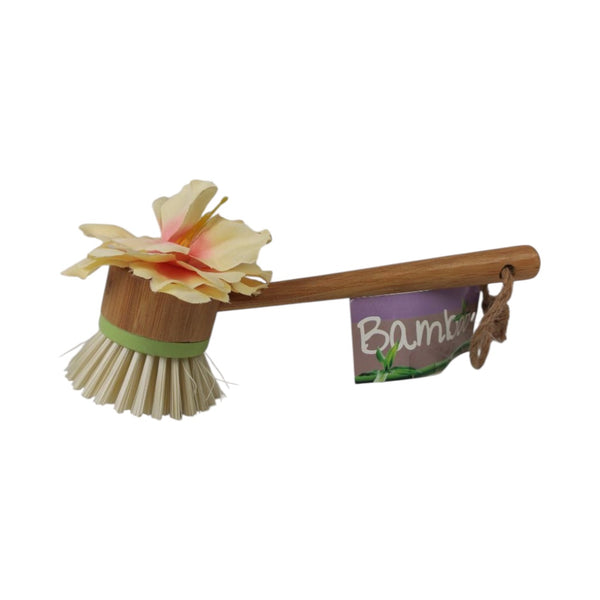 Bamboo dish brush with a scrubber head on a white background
