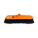 Orange broom with black bristles on a white background