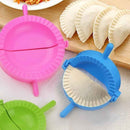 Plastic dumpling makers in pink, blue, and green for crafting delicious stuffed snacks