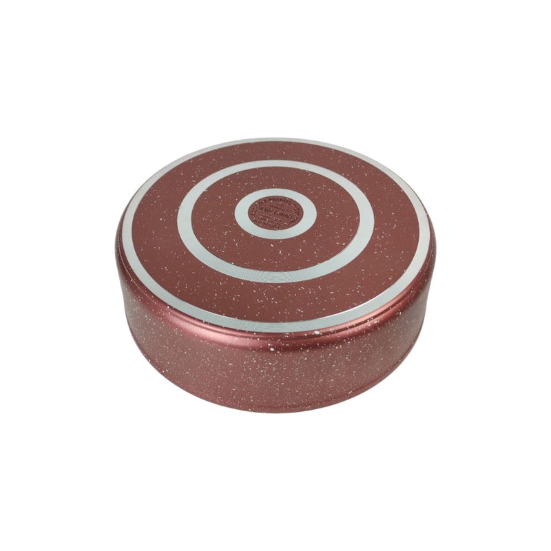 Round pink object with concentric circles on a white background