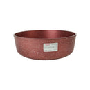 Red speckled bowl with a label on a white background