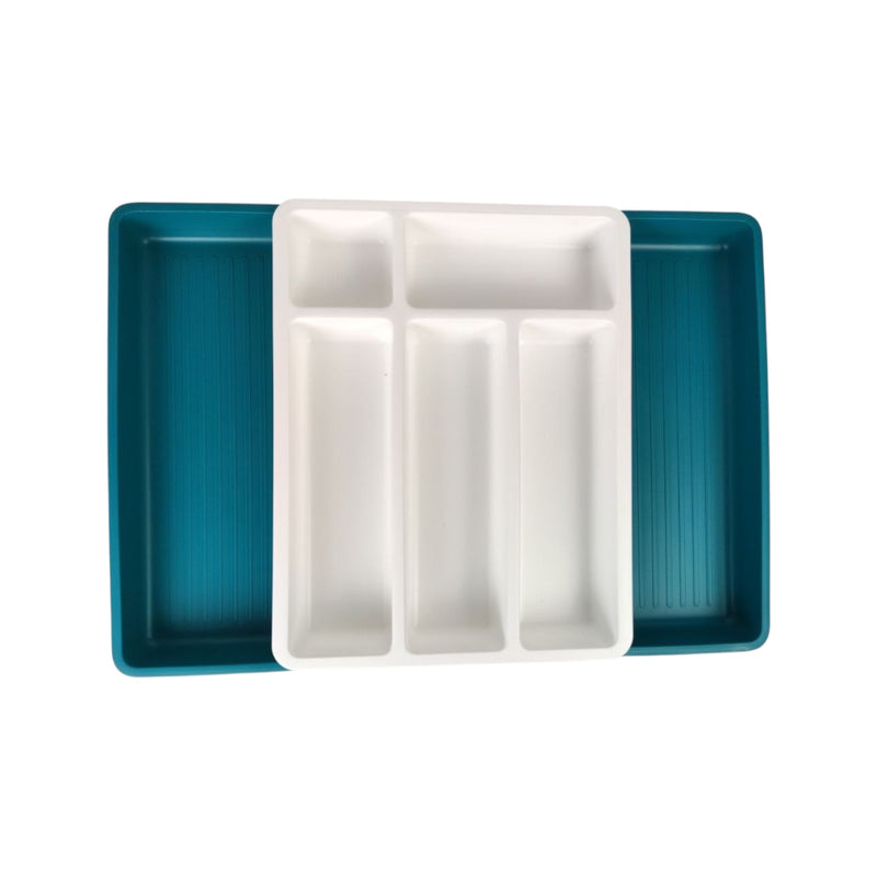 Teal and white ceramic dish with compartments on a white background