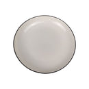 Round ceramic plate with a black rim on a white background