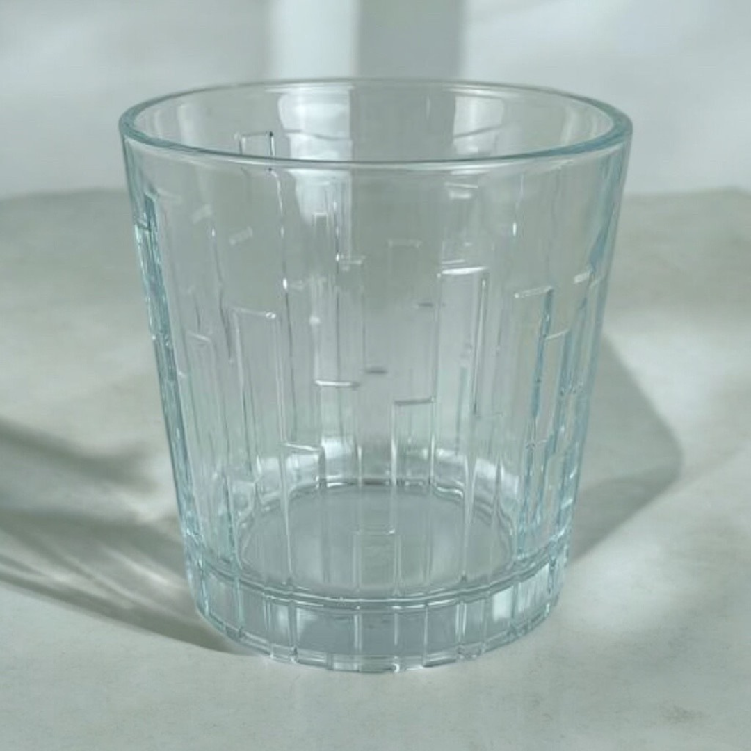 Close-Up Of Pasabahce Scala 300ml Glass Tumbler With Vertical Textured Design On Marble Surface