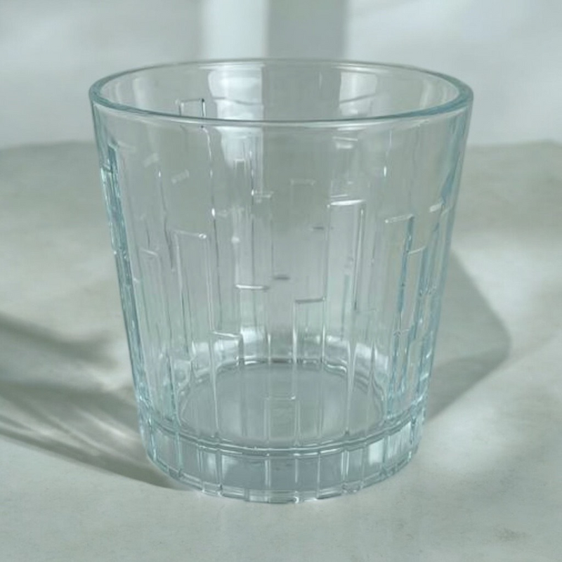Close-Up Of Pasabahce Scala 300ml Glass Tumbler With Vertical Textured Design On Marble Surface
