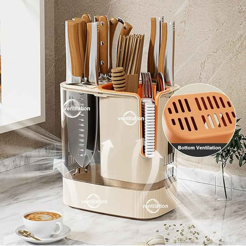 Kitchen utensil organizer with cutlery and tools on a marble surface, featuring bottom ventilation.
