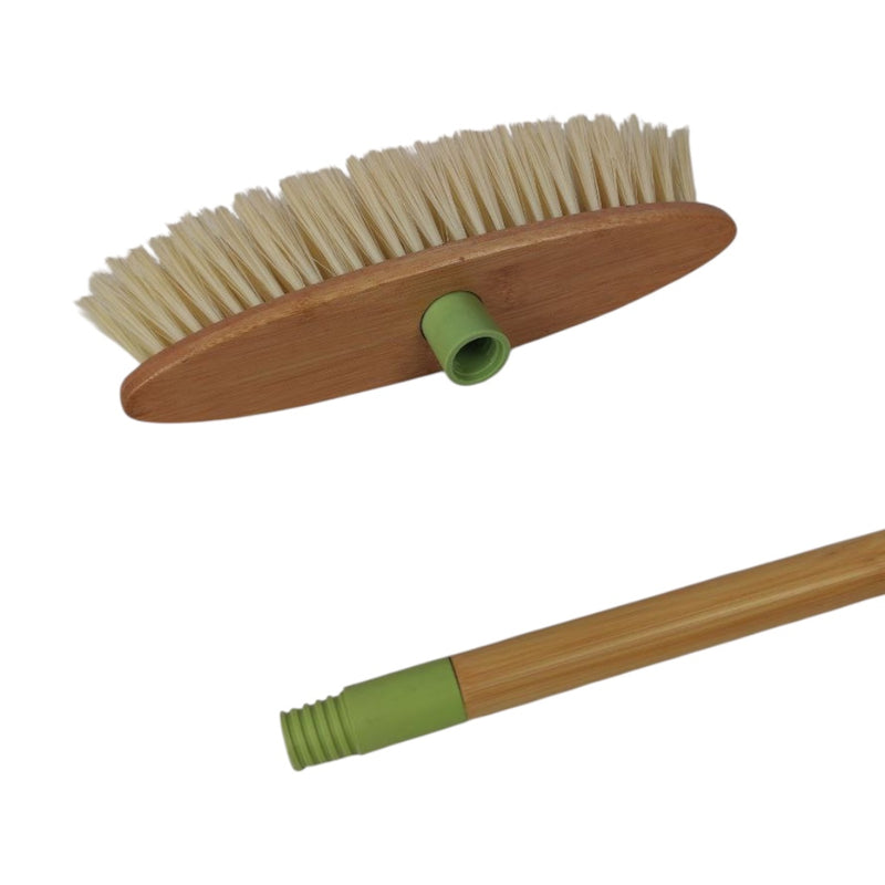 Broom with wooden handle and bristles on a white background