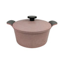 Pink speckled cookware pot with black handles and lid on a white background