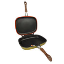 Double-sided grill pan with wooden handle on a white background