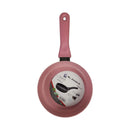 Pink frying pan with a visible brand label on a white background