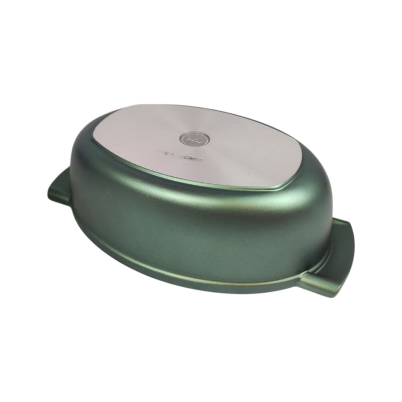 Green oval-shaped pot with a white interior on a white background