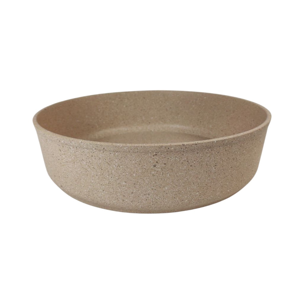 Beige ceramic bowl on a white background