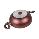 Round metallic object with a handle on a white background