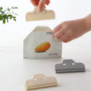Plastic food bag clip sealing a snack bag for freshness