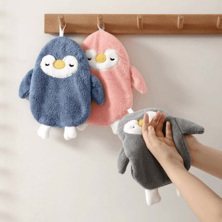 Set of Three Penguin-Shaped Bath or Cleaning Mitts in Blue, Pink, and Gray – One Being Worn on Hand – Cupindy